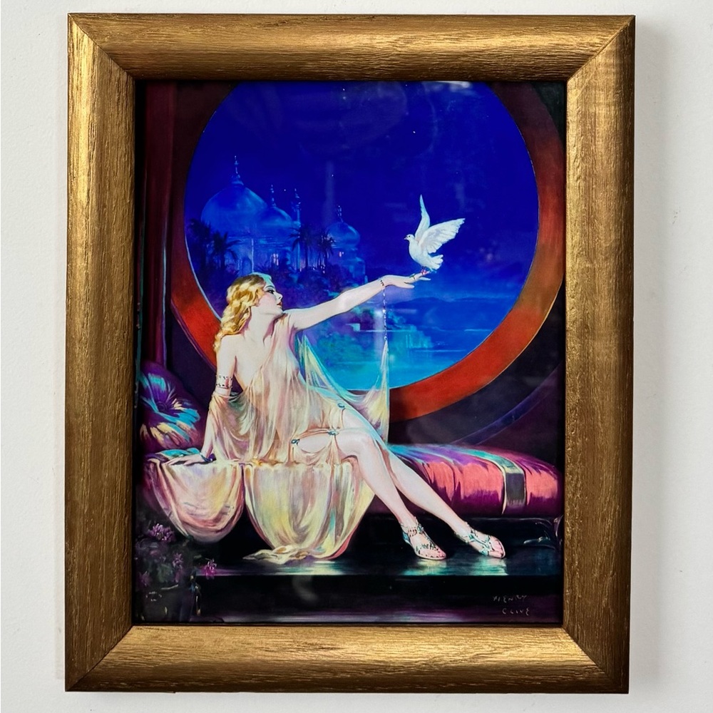 Henry Clive wall art in vintage wood frame.